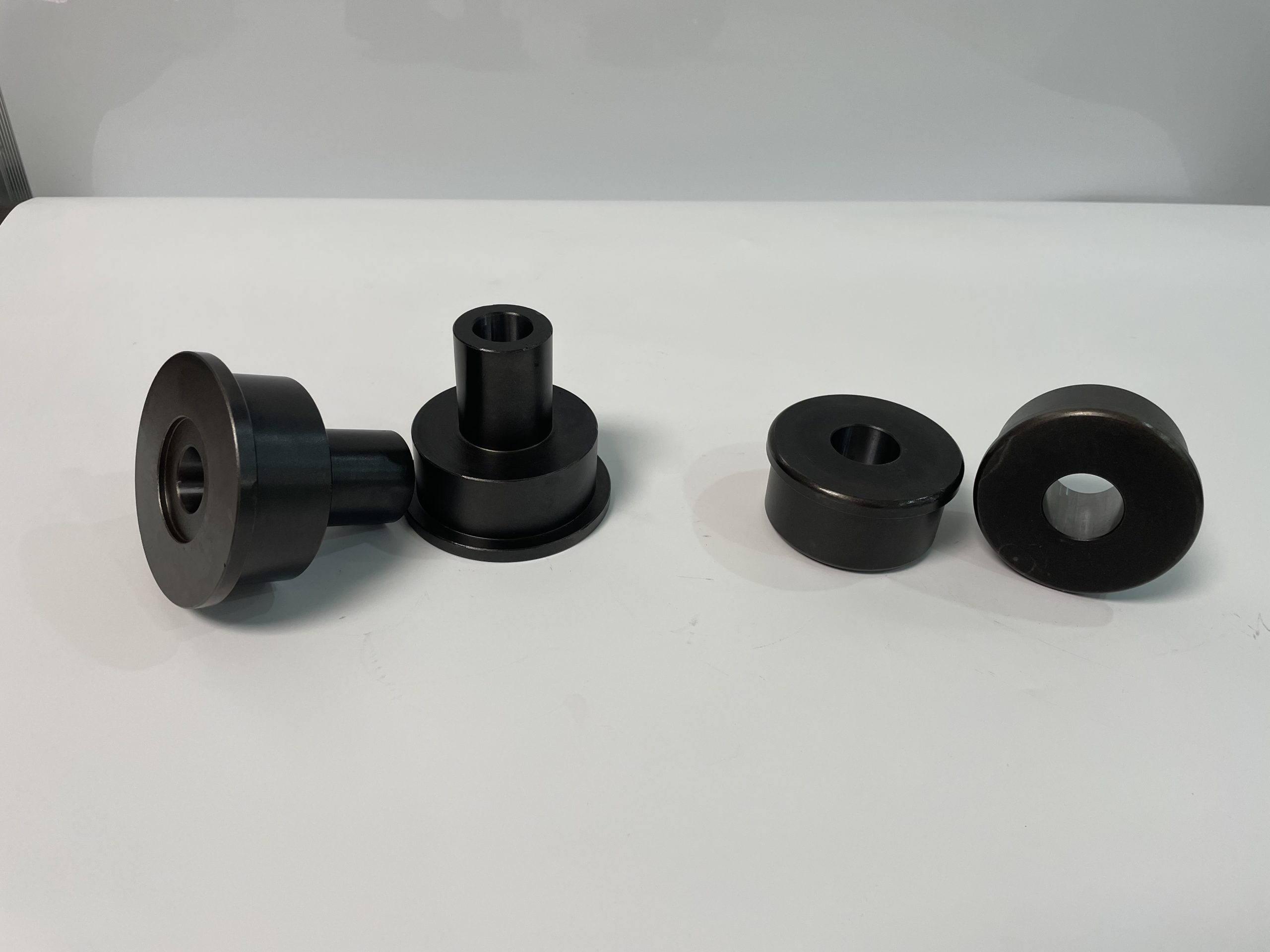 Custom black oxide guide rollers with steps for machinery